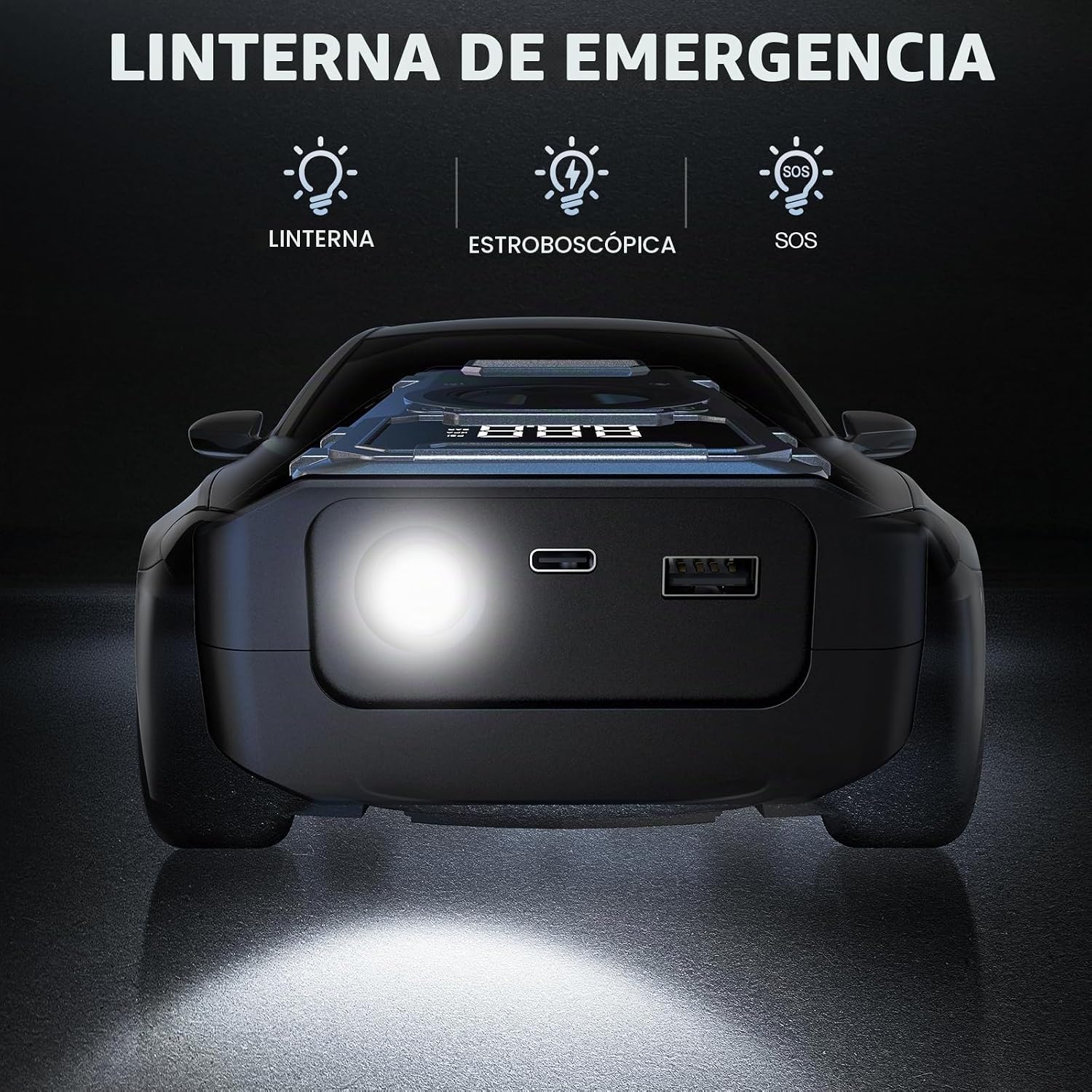 Arrancador del salto de la batería del coche con el compresor de ai...